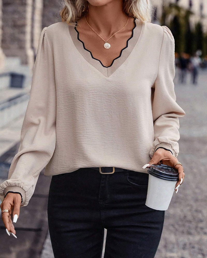 Ruffled V-neck solid color blouse