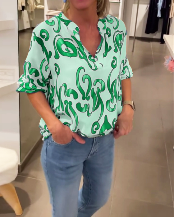 Elegant long-sleeved top with printed V-neck