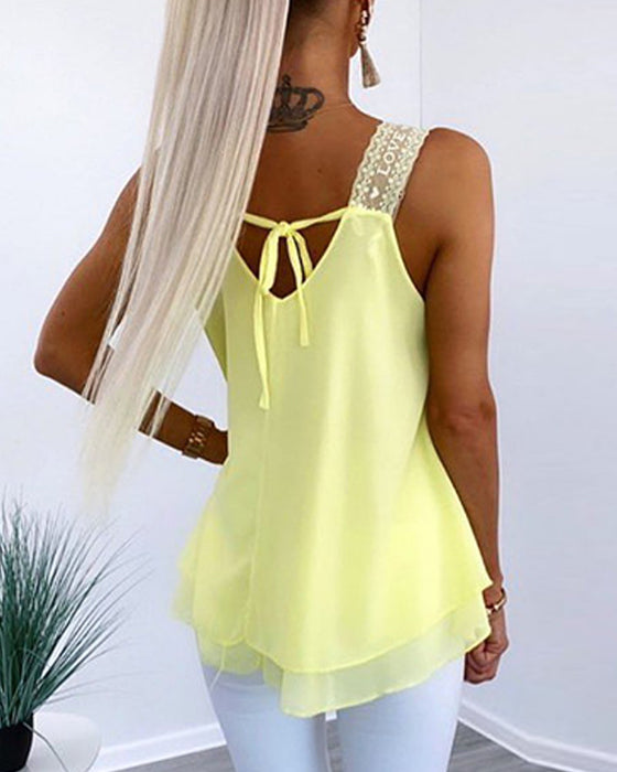 Solid color sleeveless top with stitching and laces