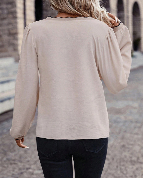 Ruffled V-neck solid color blouse