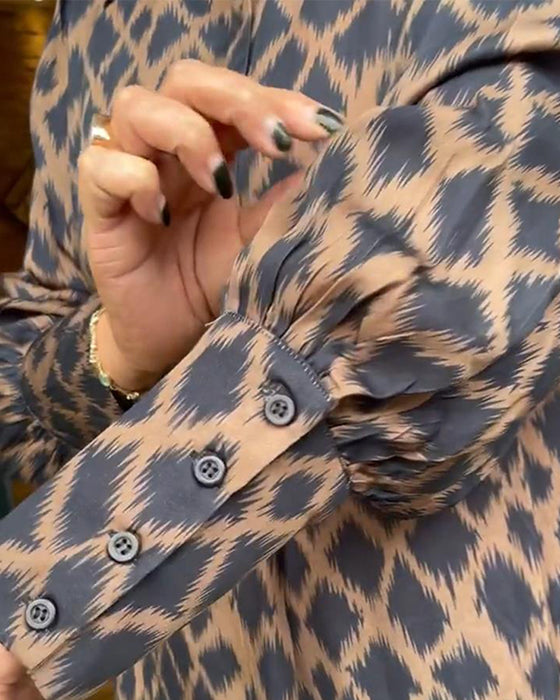 Elegant dress with contrasting geometric print and lapel